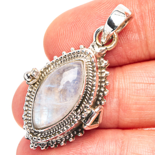 Sterling silver moonstone poison pendant with ornate frame and teardrop rainbow stone