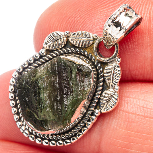 Moldavite pendant in .925 sterling silver, faceted green stone in ornate leaf bezel
