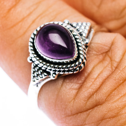 Oval amethyst cabochon sterling silver ring with intricate rope and bead detailing