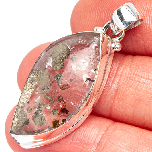 Teardrop marcasite-in-quartz pendant close-up with red and gold speckles in sterling silver