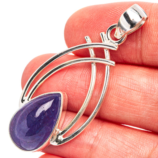 Oval tanzanite pendant in .925 sterling silver with arched frame and bezel setting