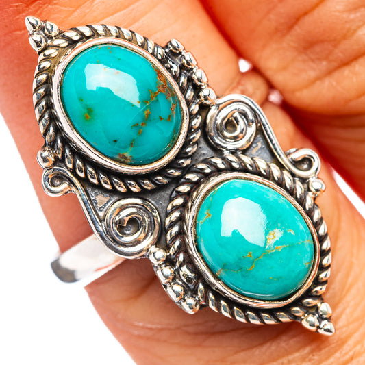 Adjustable sterling silver turquoise ring with two oval stones, ornate scroll setting