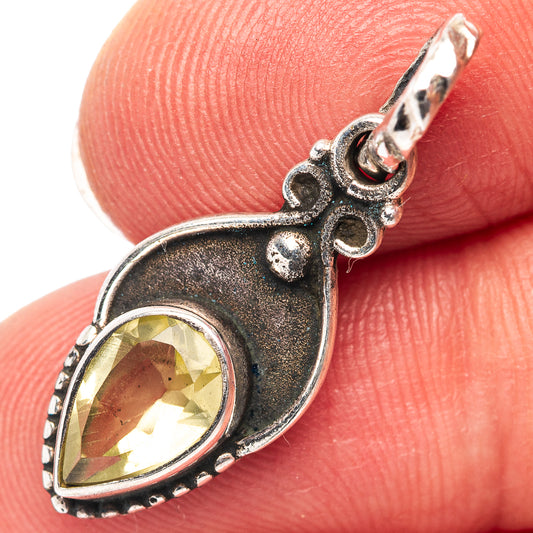 Sterling silver citrine teardrop pendant on bail, detailed frame with yellow gemstone