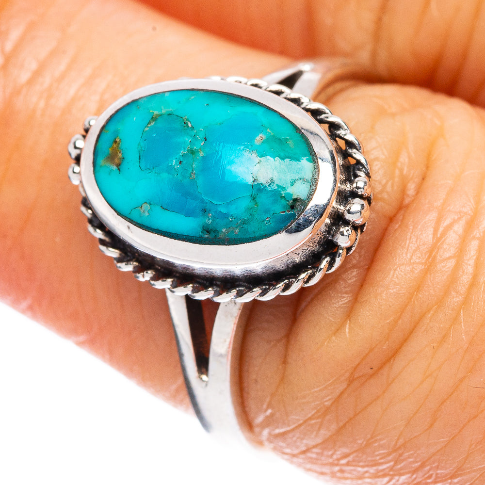 Oval turquoise cabochon ring in 925 sterling silver with ornate twisted bezel