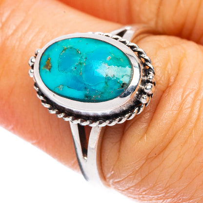 Oval turquoise cabochon ring in 925 sterling silver with ornate twisted bezel