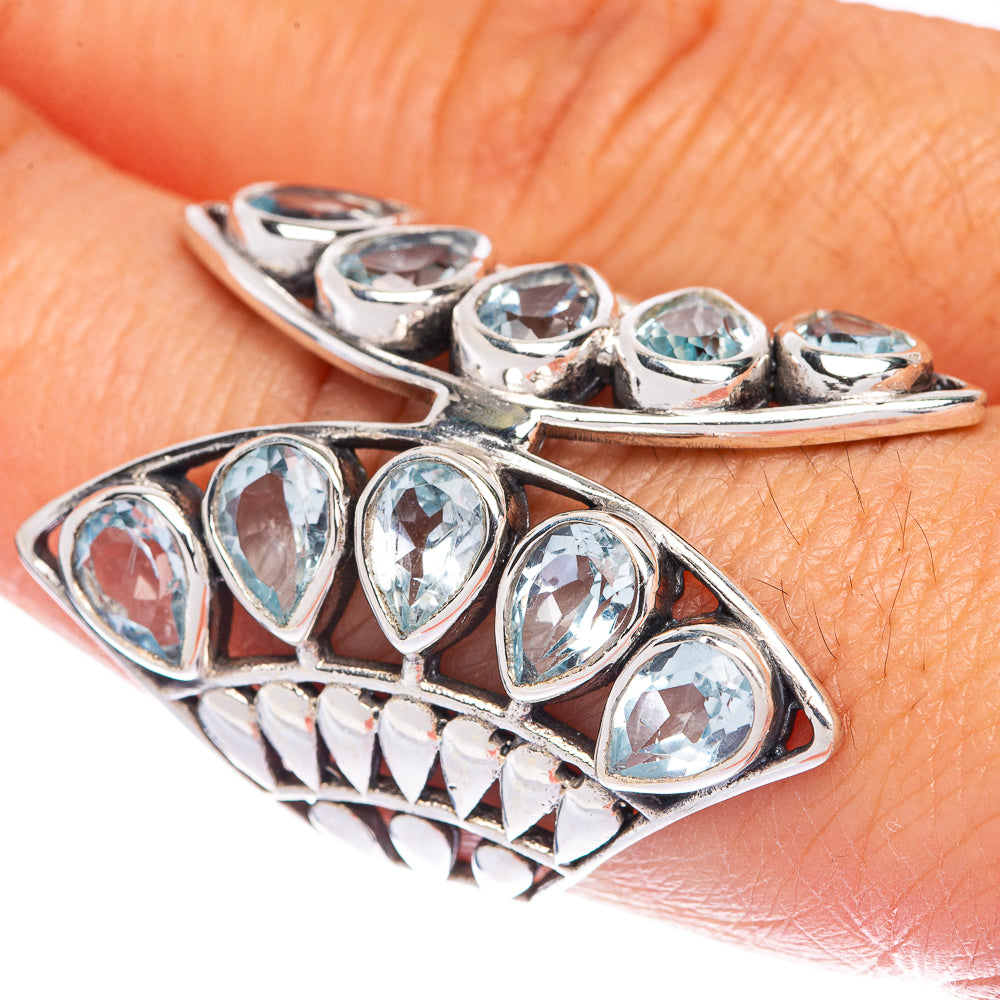 Sterling silver ring with blue oval stones, curved prongs and openwork sides