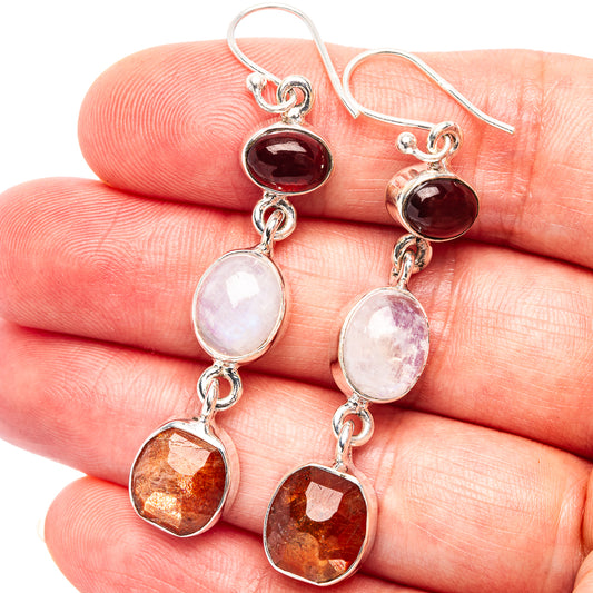 Sterling silver dangle earrings with red gemstone, white moonstone, and orange faceted drops