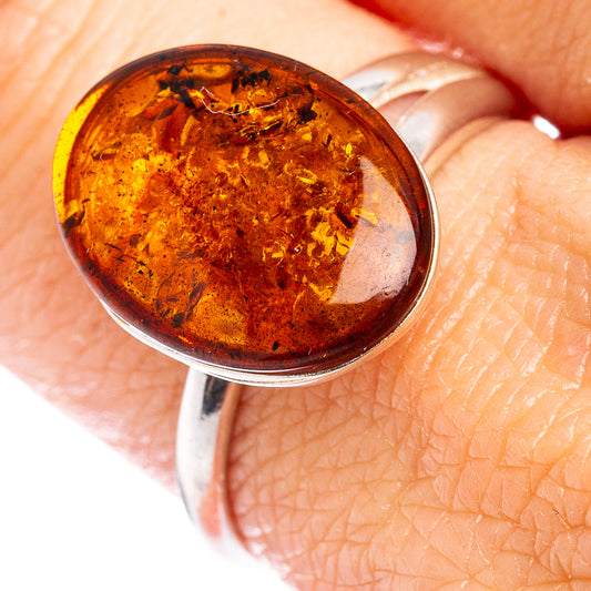 Oval Baltic amber cabochon in .925 sterling silver adjustable ring, close-up