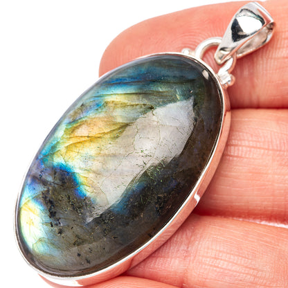Labradorite oval pendant in 925 sterling silver bezel, iridescent blue-gold flashes.
