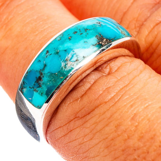 Sterling silver turquoise inlay ring on finger, oval top with metal bezel