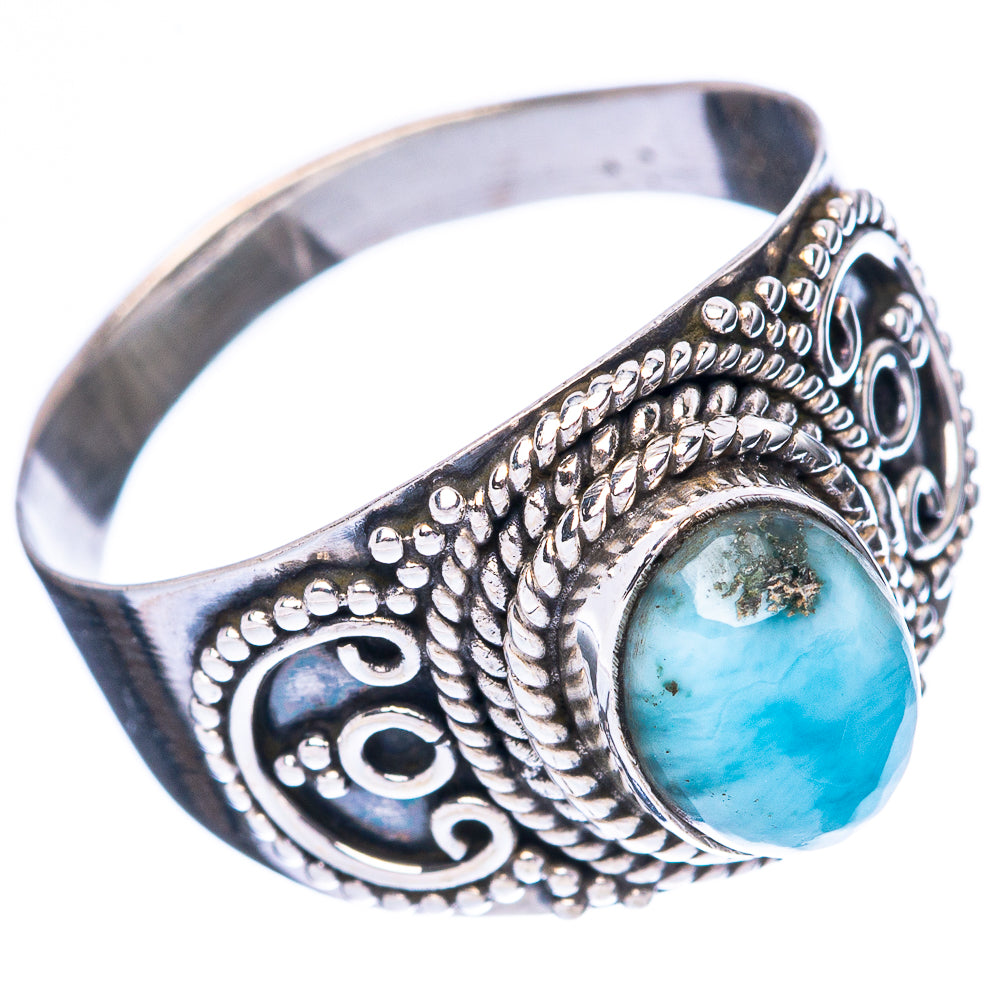 Sterling silver ring with oval larimar cabochon, textured rope bezel, and side engravings