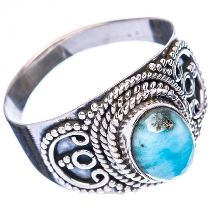 Sterling silver ring with oval larimar cabochon, textured rope bezel, and side engravings