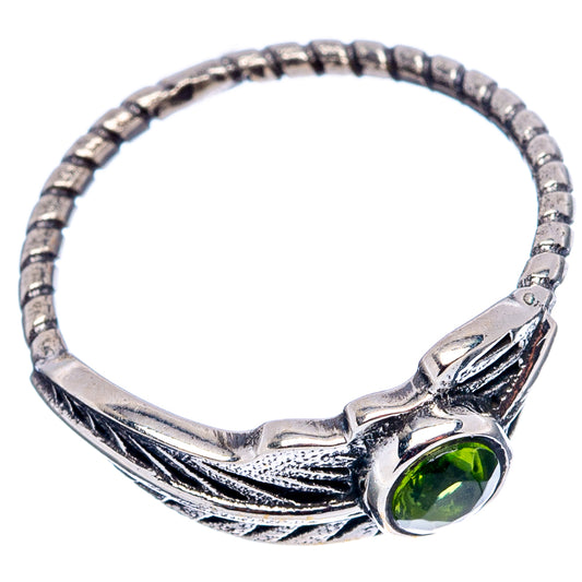 Sterling silver feather ring with round green peridot stone on braided band