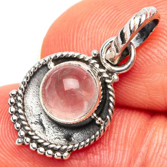 Rose quartz dainty pendant close-up, .925 sterling silver oval pink stone setting