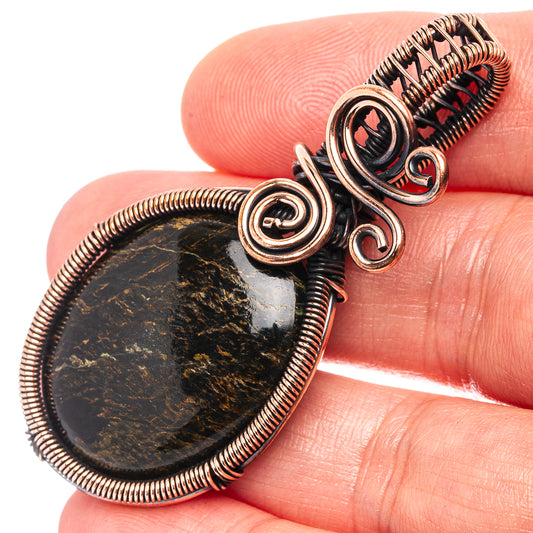 Oxidized copper wire-wrapped pendant with oval pietersite stone and spiral coils