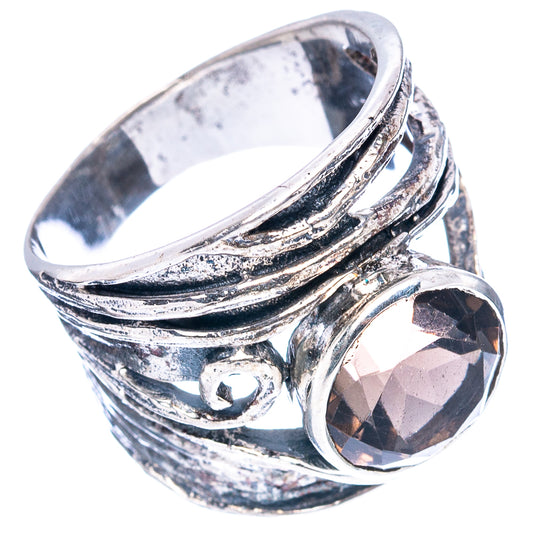 925 sterling silver ring with swirling band detail and dark smoky oval stone set.