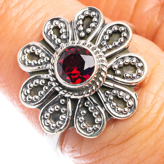 Sterling silver garnet flower ring with dark red round gemstone, size 7.25