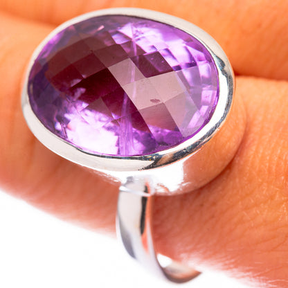 Sterling silver ring with large oval faceted amethyst, bezel-set stone with glossy facets
