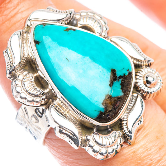 Turquoise oval gemstone sterling silver ring with ornate side carvings, adjustable