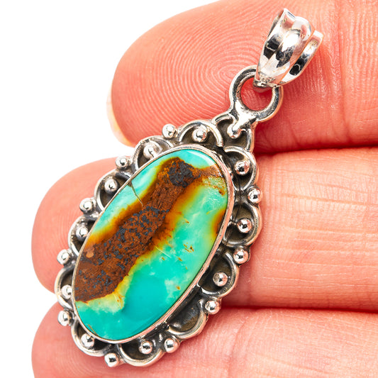 Oval turquoise pendant in .925 sterling silver with ornate beaded bezel and bail