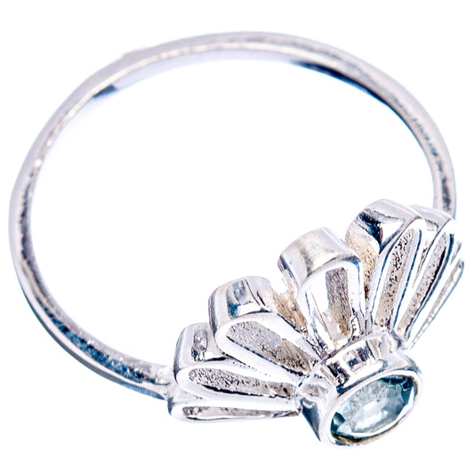 Daisy-style .925 sterling silver ring with round blue topaz center stone