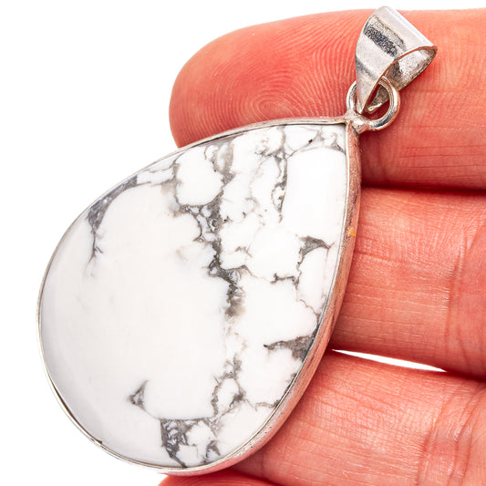 Teardrop howlite pendant with silver bail, white stone with black marbling on hand