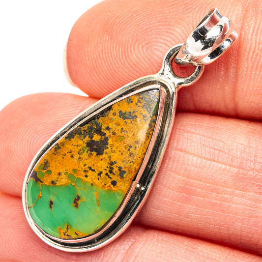 Turquoise pendant close-up on .925 sterling silver bail, pear-shaped stone with green-orange matrix