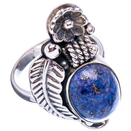 Sterling silver ring with oval blue sodalite cabochon and ornate flower setting