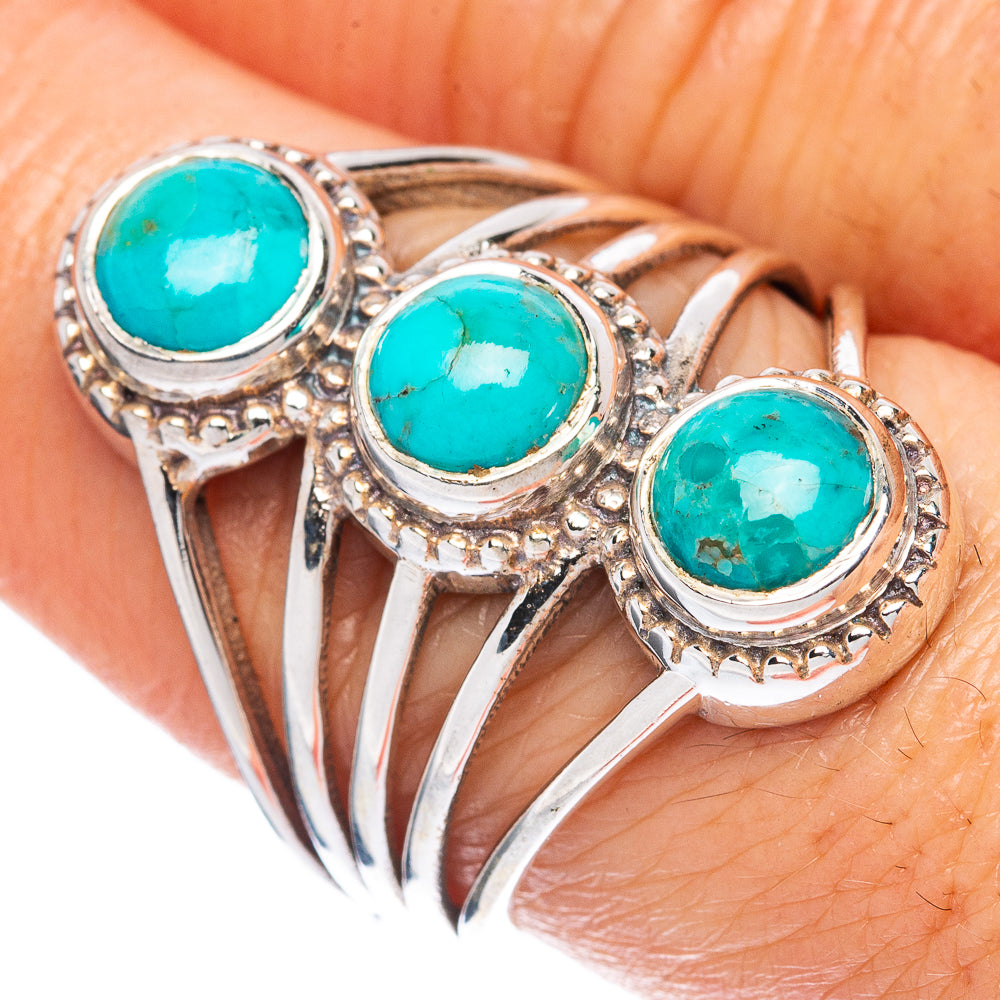 Sterling silver ring with three turquoise cabochons, openwork bands and rope bezel