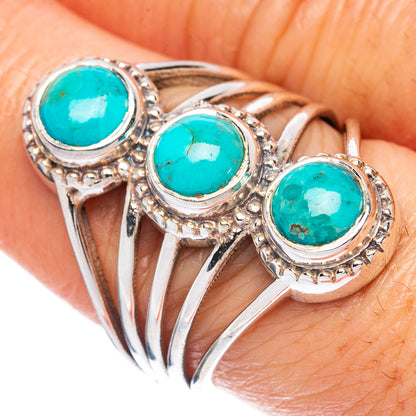 Sterling silver ring with three turquoise cabochons, openwork bands and rope bezel