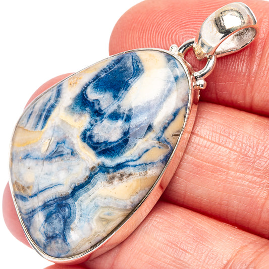 Sterling silver scheelite teardrop pendant with blue-and-white stone and loop bail