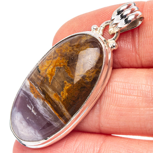 Oval sterling silver agate pendant with marbled amber, brown, and white tones