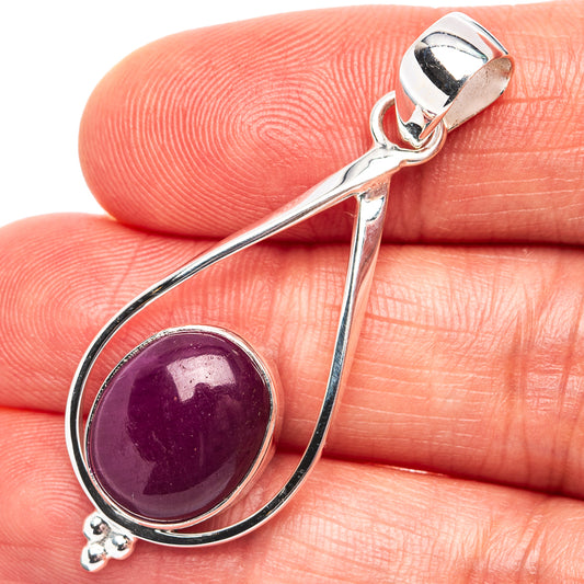 Sterling silver teardrop ruby pendant with round purple-red cabochon and loop bail