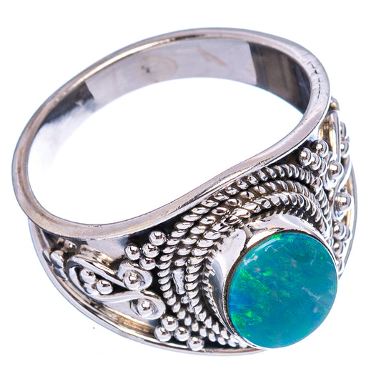 Sterling silver opal ring, side view with oval teal gemstone and engraved band
