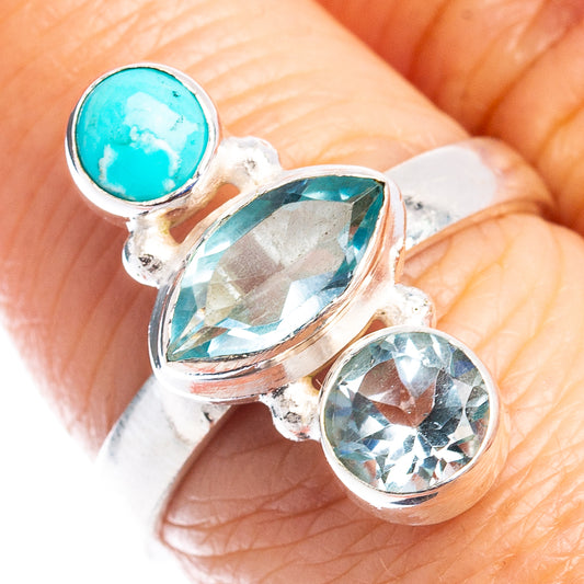 Sterling silver ring with turquoise oval cabochon and blue gemstone accents
