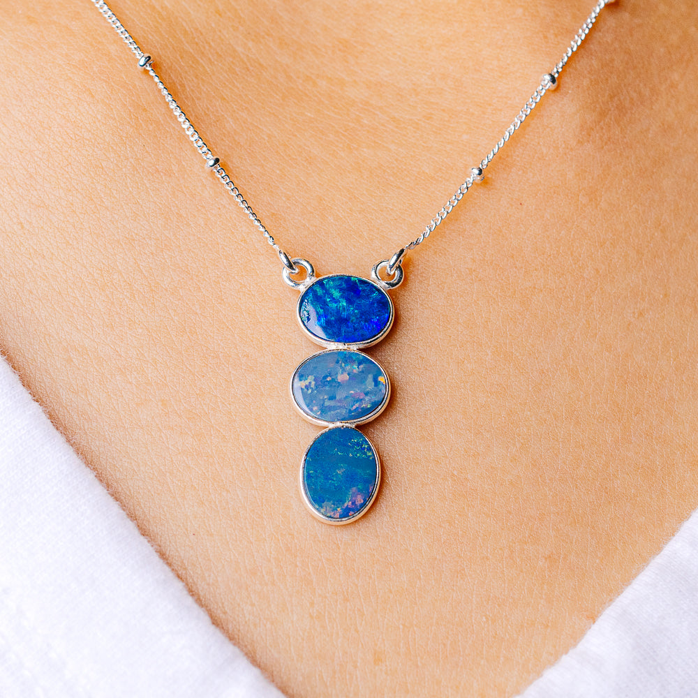 Sterling silver opal necklace with three stacked oval blue opal cabochons
