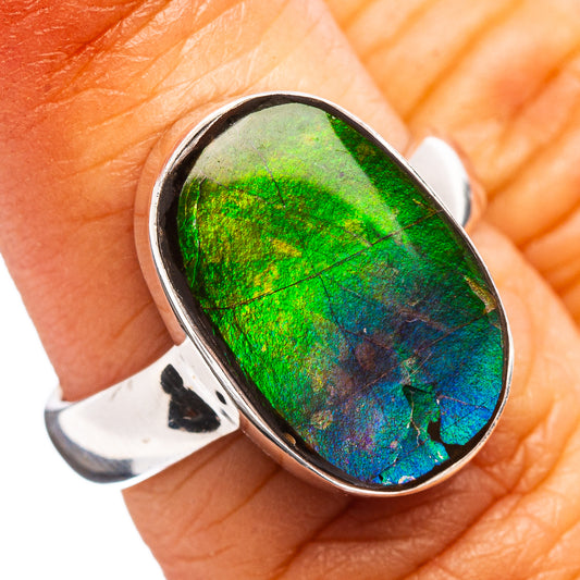 Oval ammolite gemstone ring, polished sterling silver with bright green-to-blue iridescence