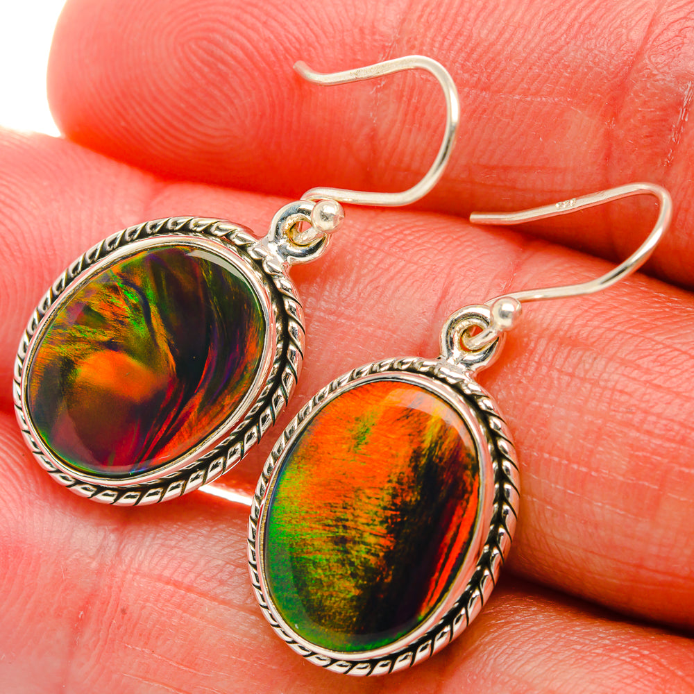 Sterling silver oval opal drop earrings with rainbow iridescent cabochon and ornate bezel