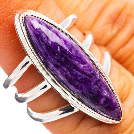 Sterling silver ring with purple teardrop charoite cabochon, open split band