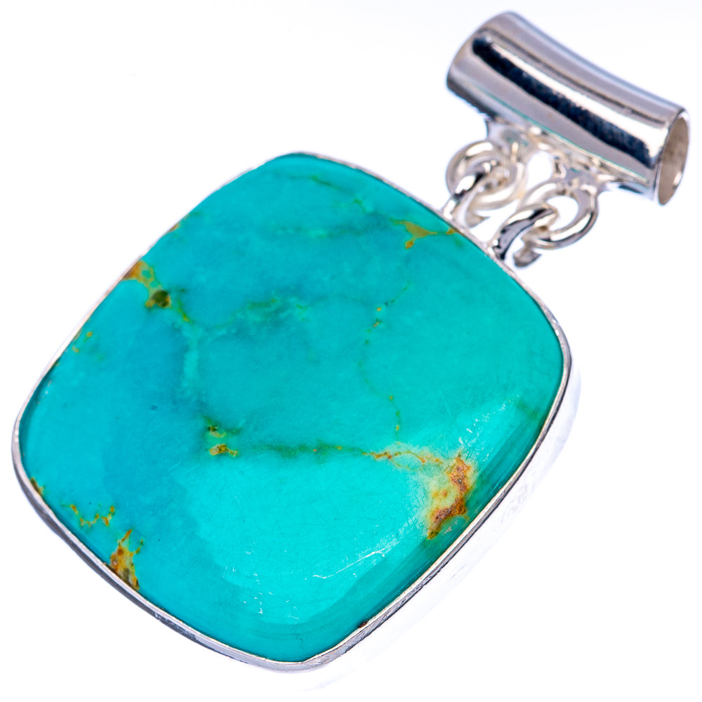 Turquoise gemstone pendant with silver bail, oval bezel, and rope-like detailing