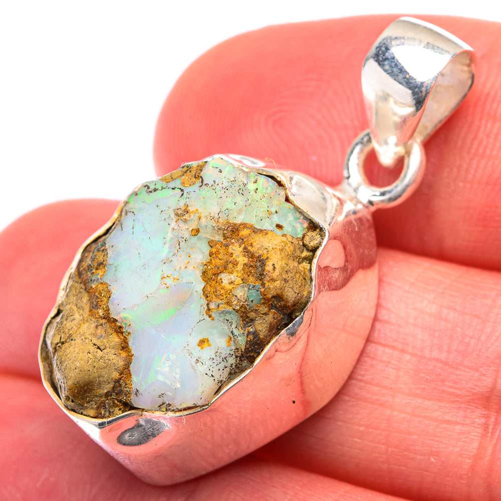 Raw opal pendant with irregular bezel, green-blue flash in sterling silver