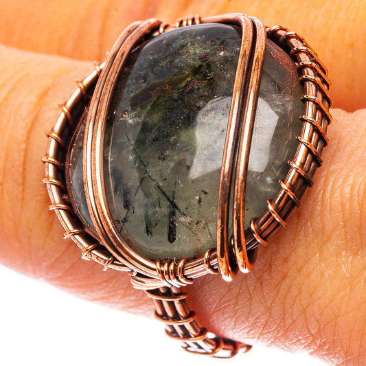 Oxidized copper wire ring with oval prehnite stone, side cage bands and twists