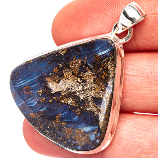 Teardrop boulder opal pendant in sterling silver with blue and gold flecks, polished frame