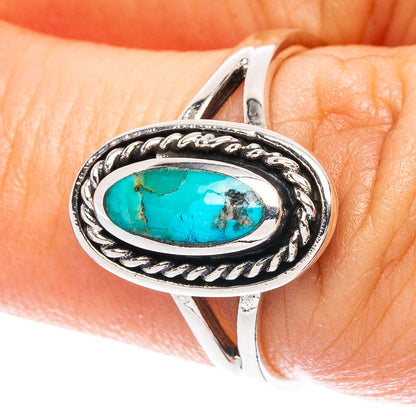 Oval turquoise in sterling silver ring with rope-edge setting, size 6.75