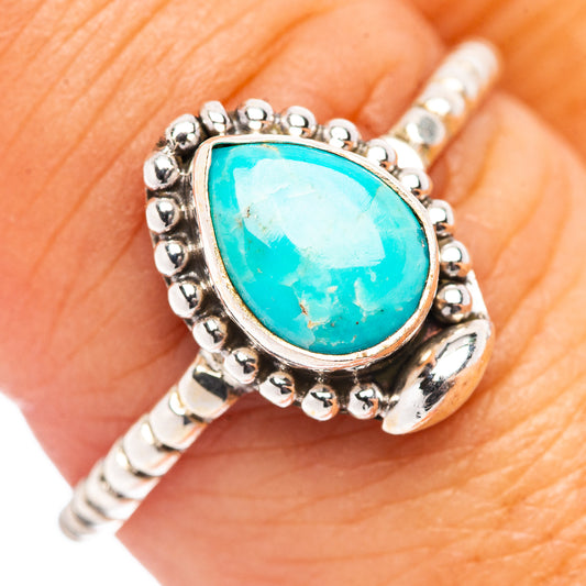 Turquoise cabochon sterling silver ring with beaded halo and oval center stone