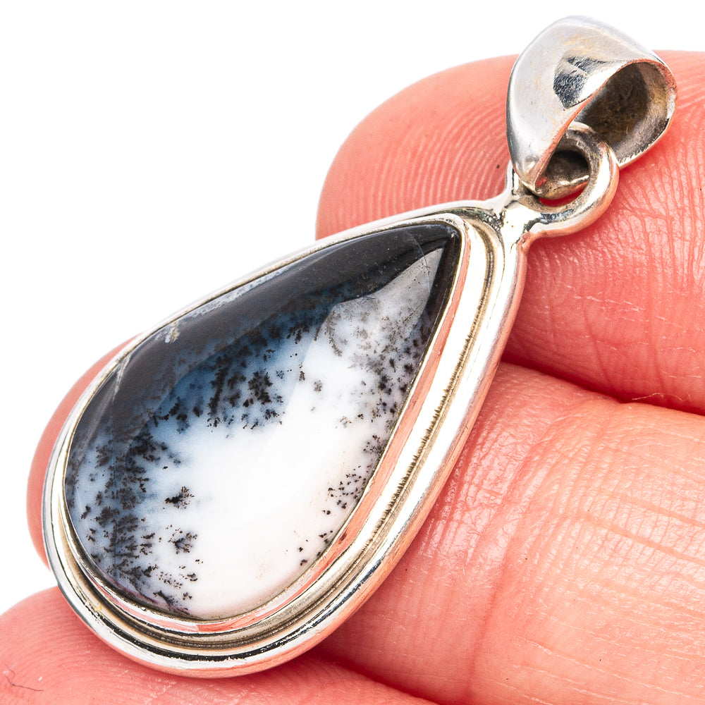 Dendritic opal teardrop pendant in sterling silver with white and dark blue stone