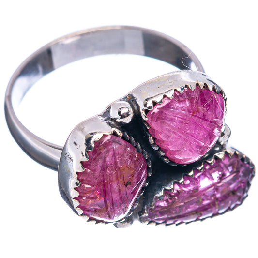 Sterling silver ring with carved magenta red ruby stones on blackened gallery