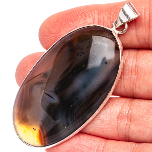 Silver-plated pendant necklace with oval Montana agate in dark gray with amber edges