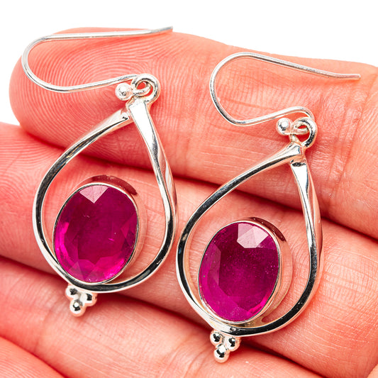 Ruby-red teardrop glass earrings in .925 sterling silver with faceted center, pair