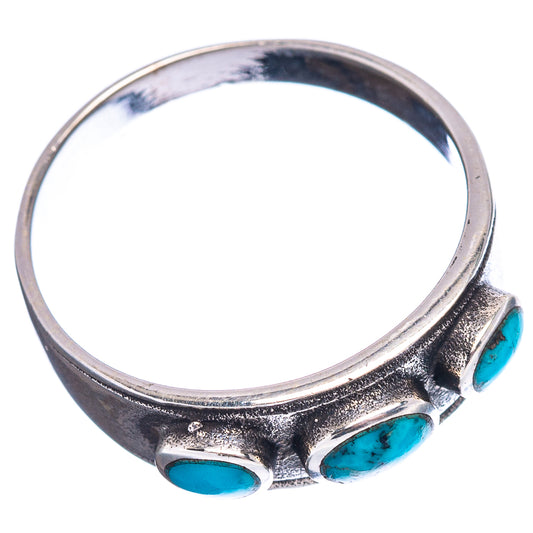 Sterling silver ring with three oval turquoise stones, top view, textured band
